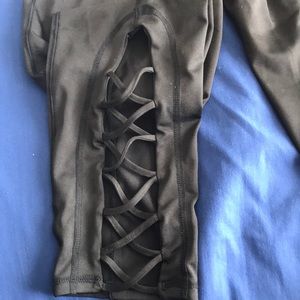 Black leggings cross on back of ankles